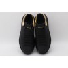 AMQ black oversized sneakers with gold heel