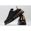 AMQ black oversized sneakers with gold heel