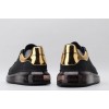 AMQ black oversized sneakers with gold heel