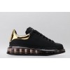 AMQ black oversized sneakers with gold heel